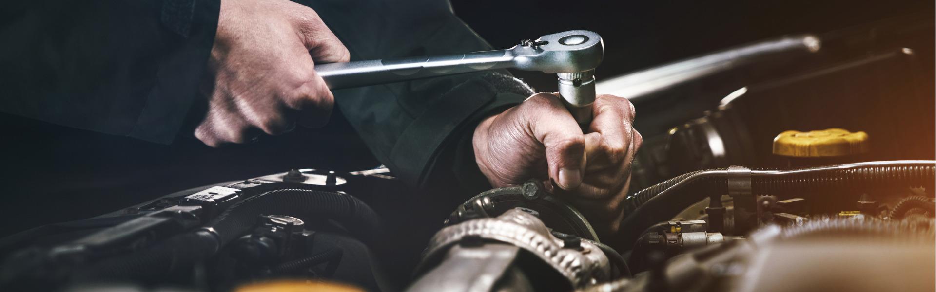 Auto mechanics fixing car