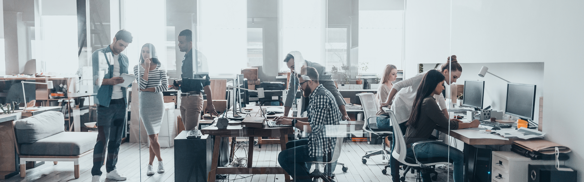 A group of people working in a startup office.