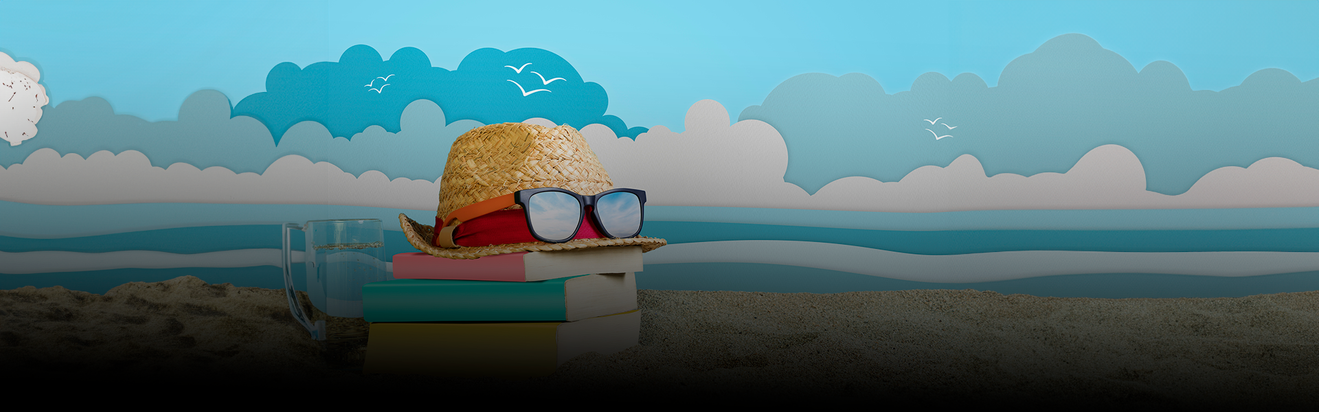 books, straw hat, sunglasses on a beach