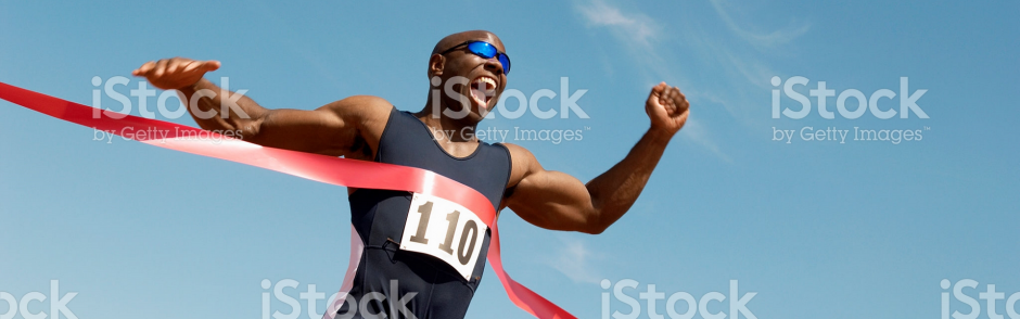 A runner crossing the finish line.