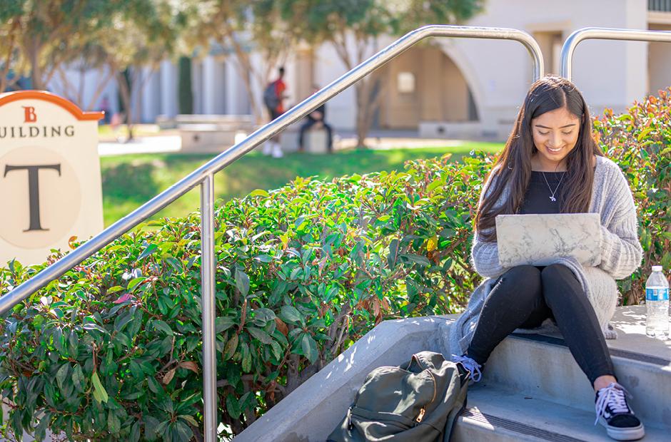 LBCC Students working on a laptop on campus