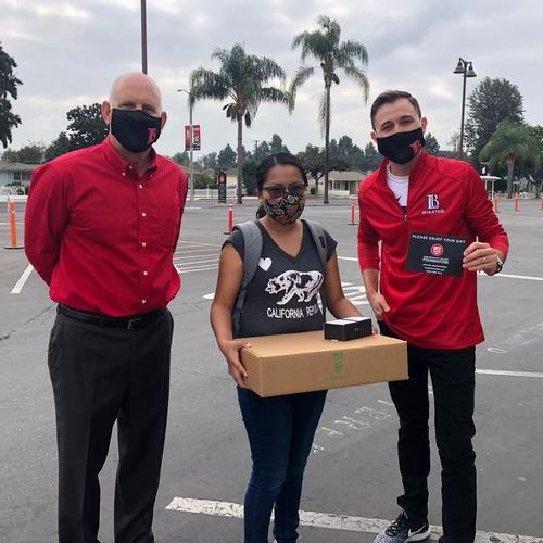 LBCC staff handing out Chromebooks