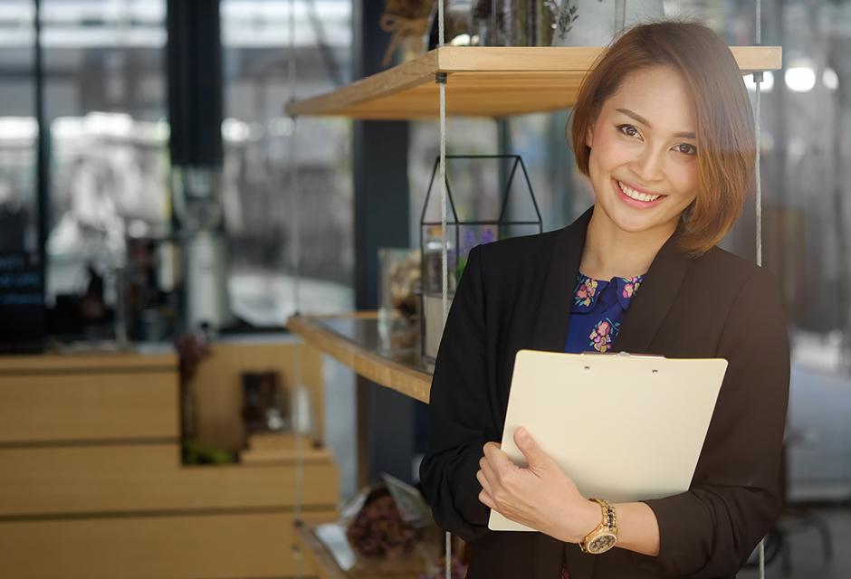 Secretary woman holding a document file and smile on face.