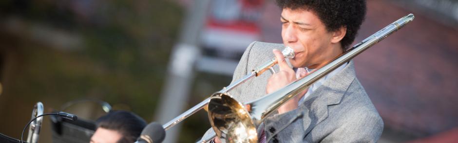 A musician playing the trombone.