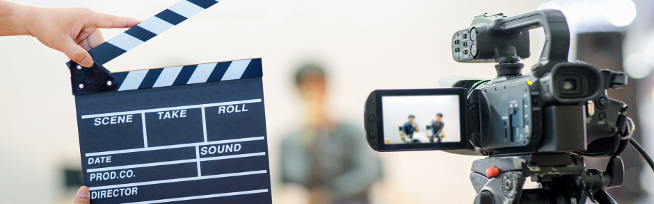 Man hands holding movie clapper