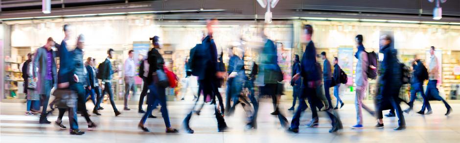 Sociology Concept - Busy Crowd walking in different directions