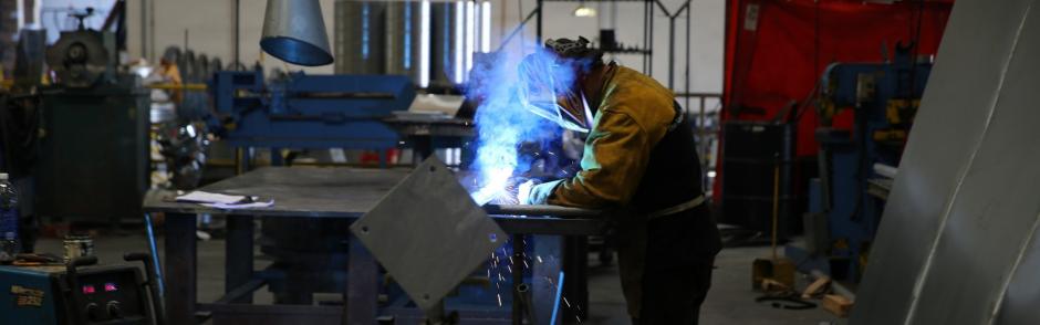 A worker performing welding tasks