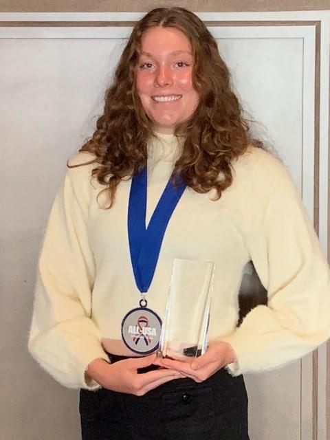 Isabella Shead headshot, holding ALLl-USA award