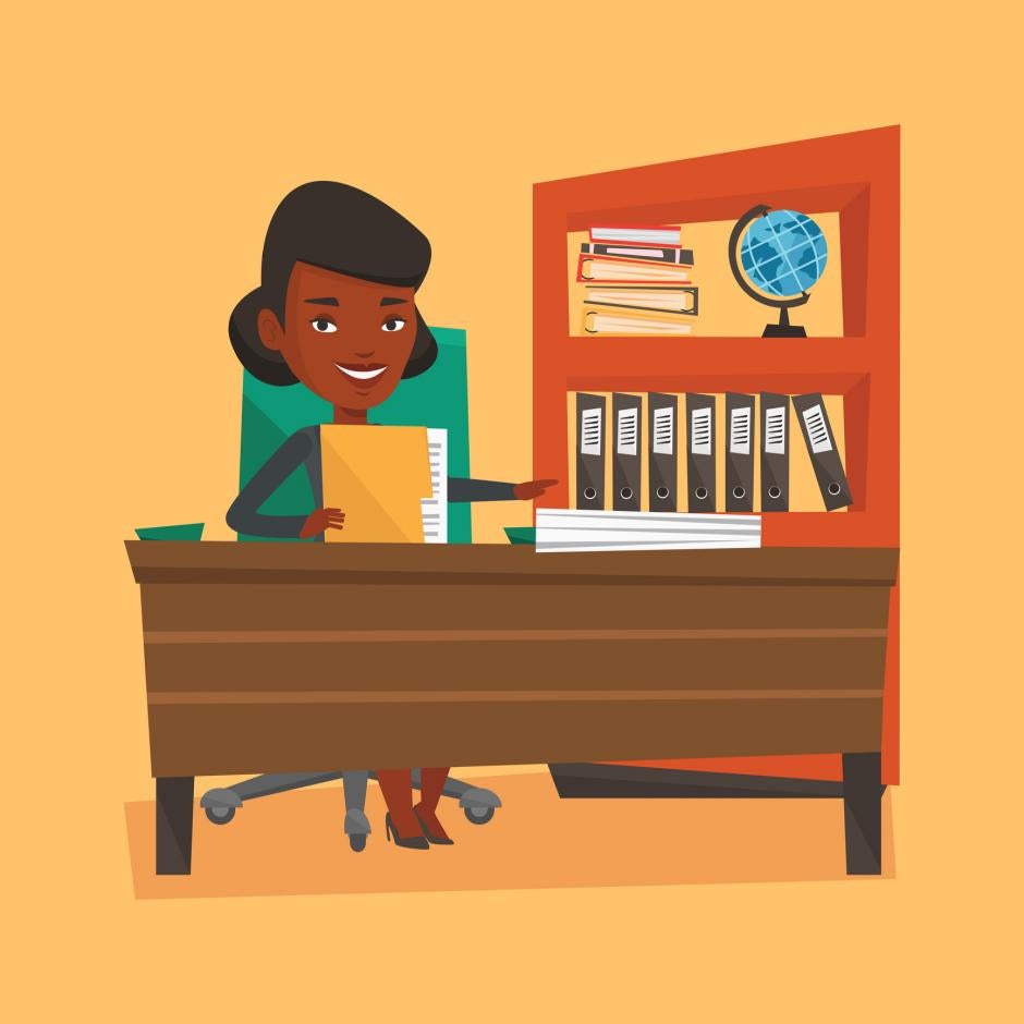 An african-american happy office worker working with documents