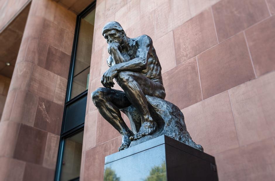 A statue of a man who is thinking.