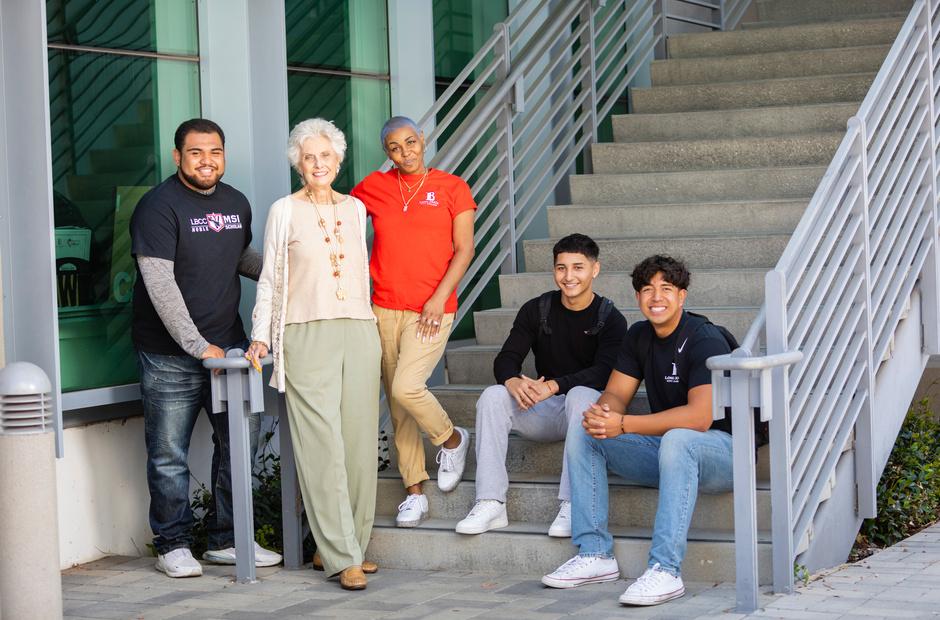 Multiracial and different age group of LBCC students next to staircase on PCC campus 