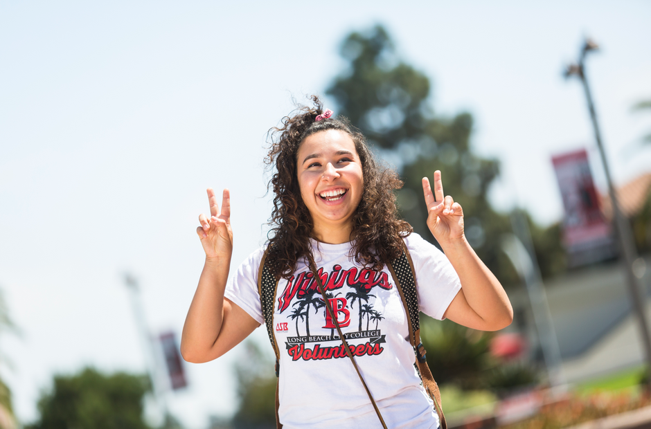 An LBCC student flashing the #2 with her fingers.