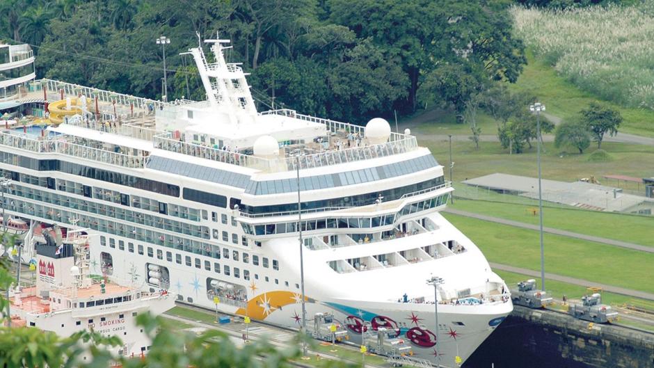 A cruise ship sailing through the panama canal