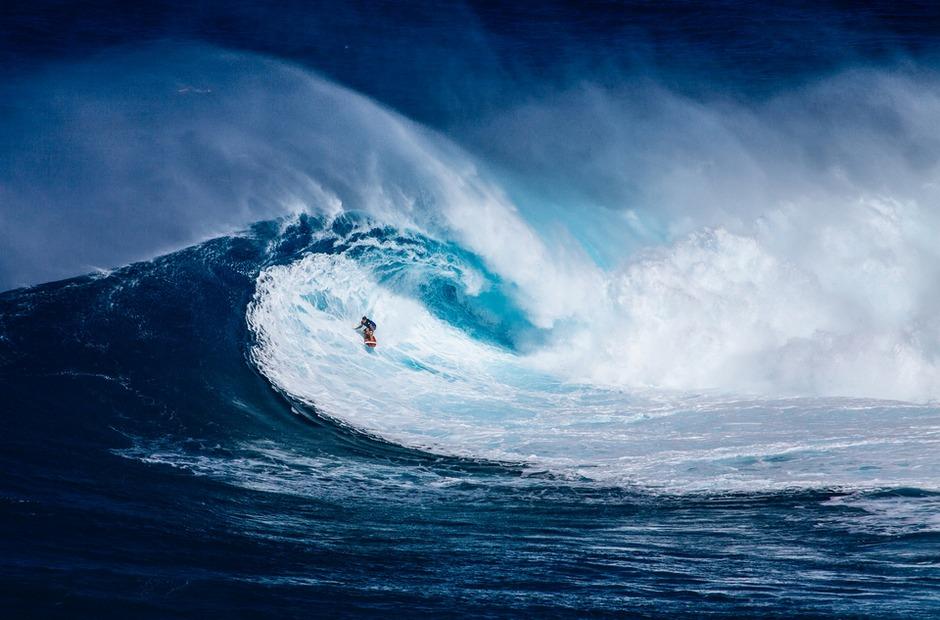 A surfer riding a big wave.