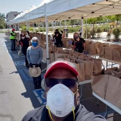 LBCC staff handing out food to passing cars.