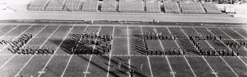 A vintage photo of the LBCC Marching Band at Veteran's Stadium.