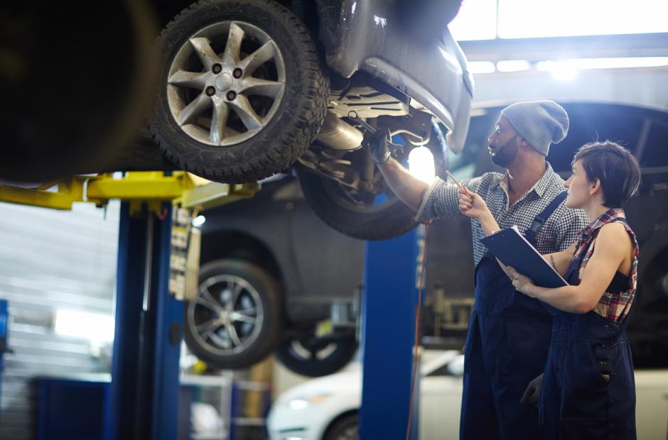 A women and a man working in auto shop in Automotive Repair Session