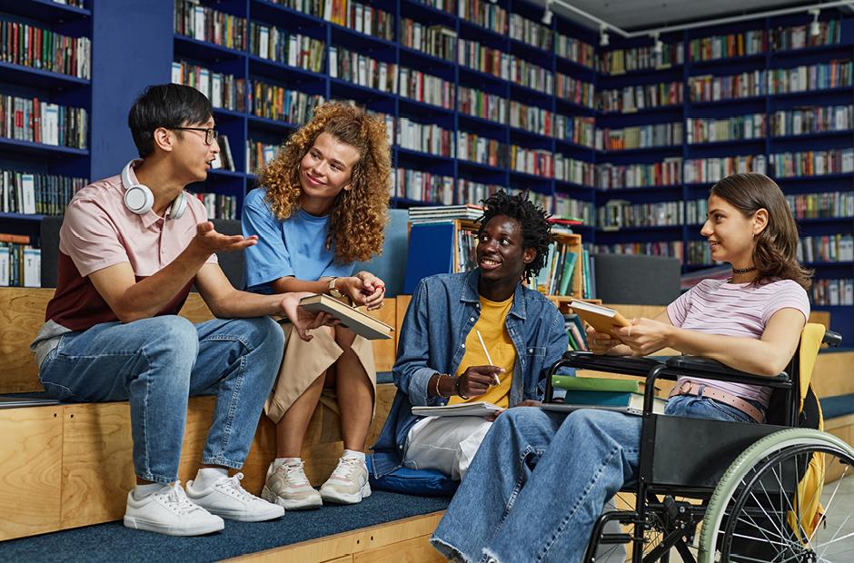 Diverse Group of Students Chatting in the library