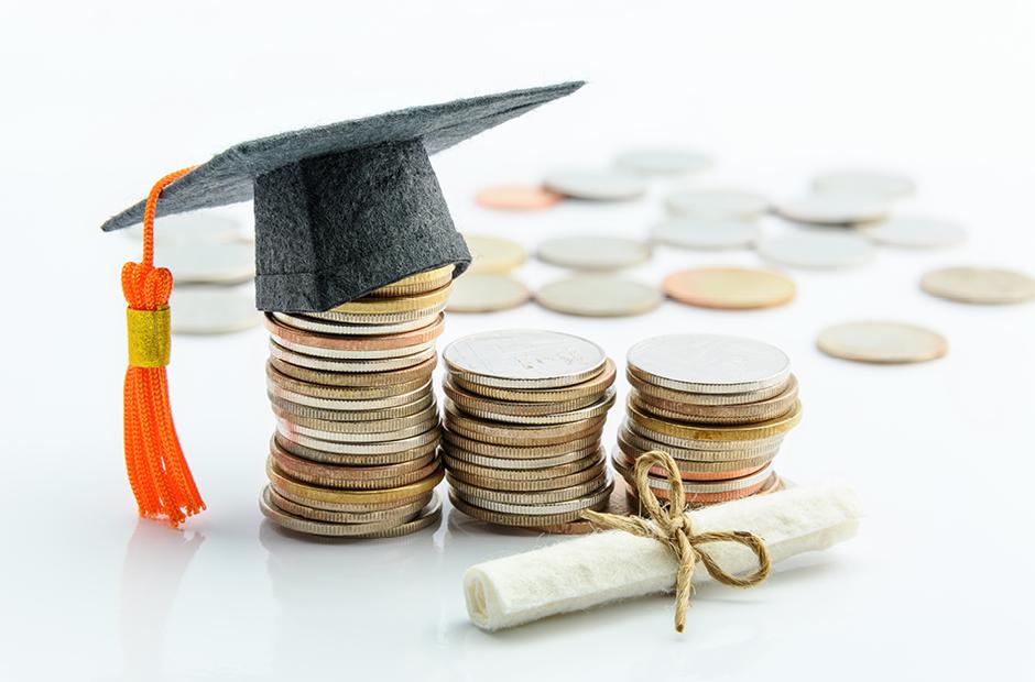Money cost saving or money reserve for goal and success in school, higher level education concept : US dollar coins / cash, a black graduation cap or hat, a certificate / diploma on white background.