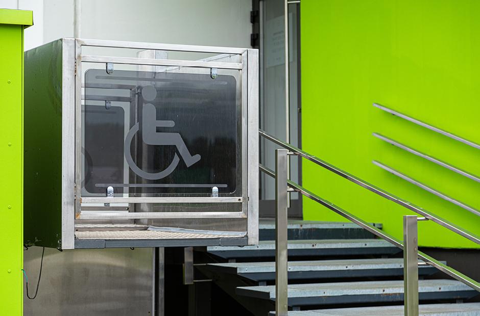 Entry to a building with convenient elevator for people in wheelchairs 