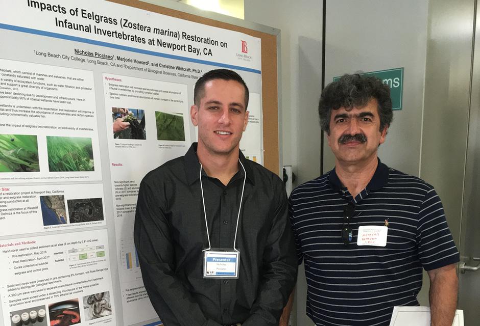 LBCC students and professor next to science research board in the Bridges to the Baccalaureate Program