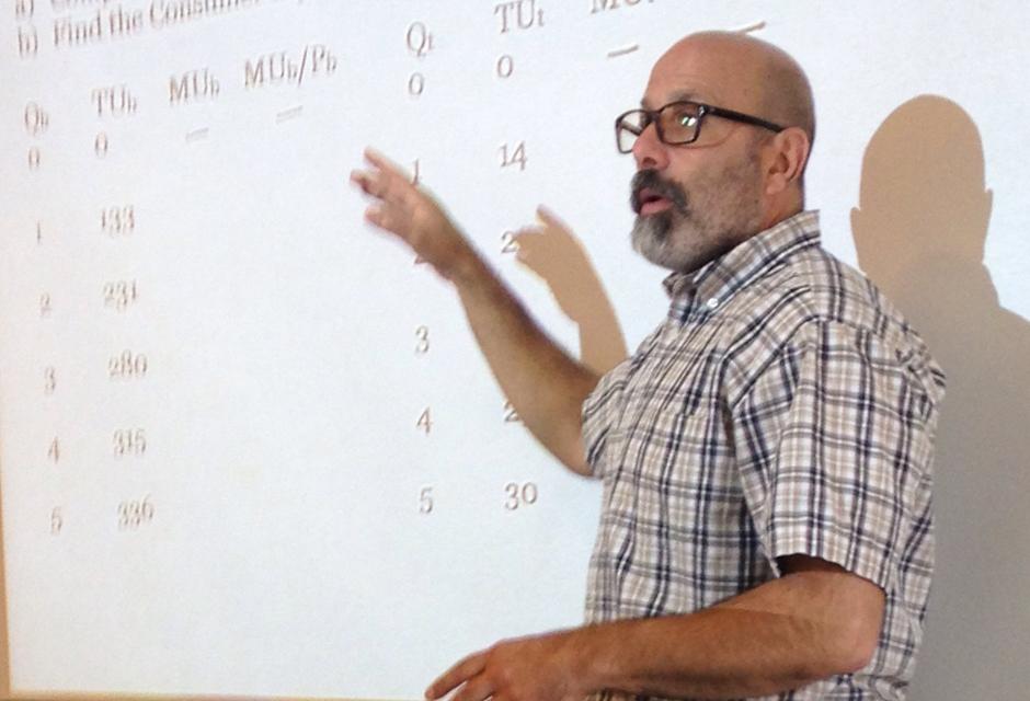 Professor Beebe teaching Economics in classroom