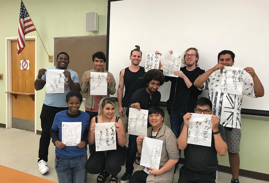 LBCC Japanese Club students practicing calligraphy
