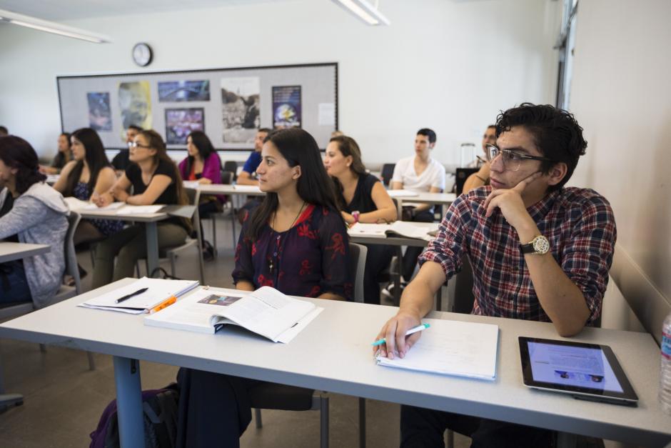 Students listening to a class lecture.