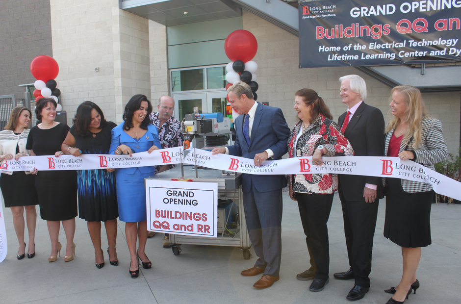 Board of Directors cutting the ribbon to open a new building.