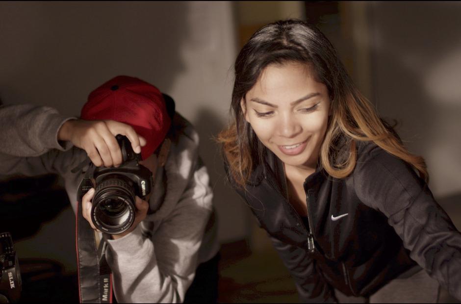 Students taking photos and staging a scene.