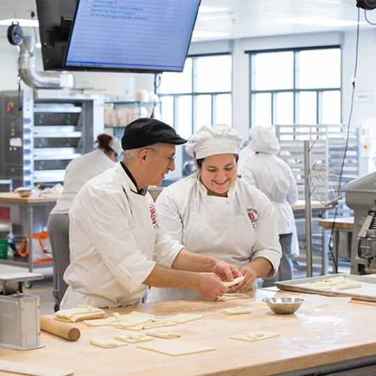 LBCC students learning baking ham and cheese pastry